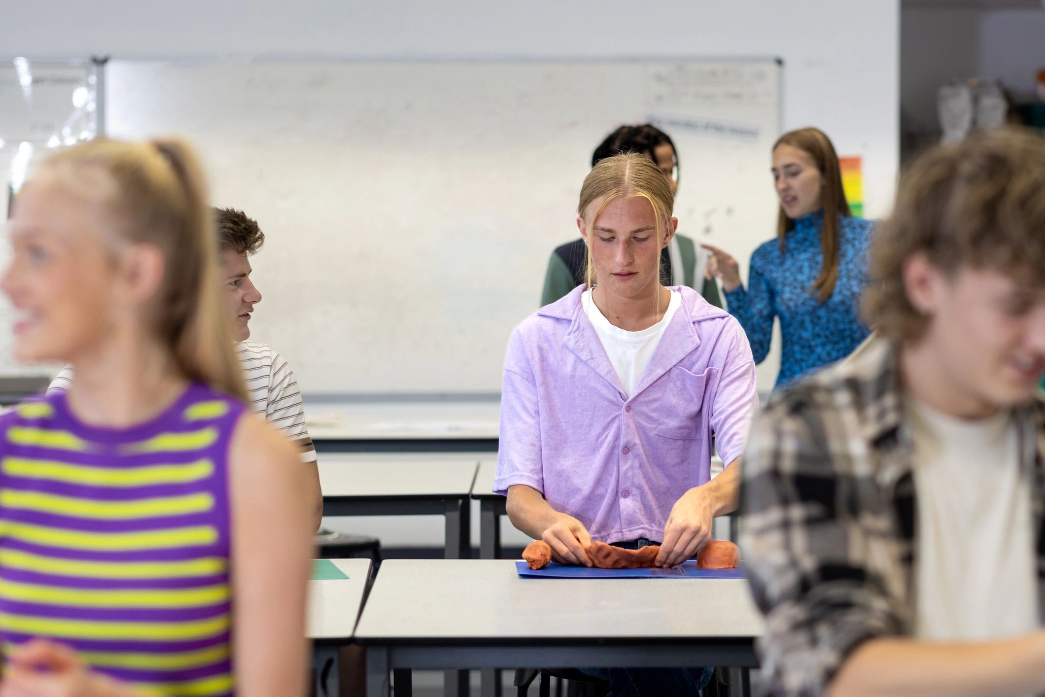 Students engaged in creative classroom learning