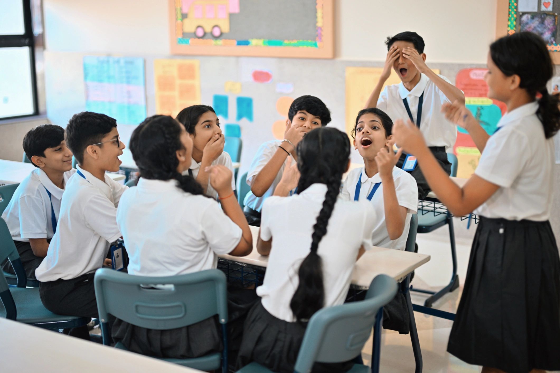 Students gathered around a classroom table