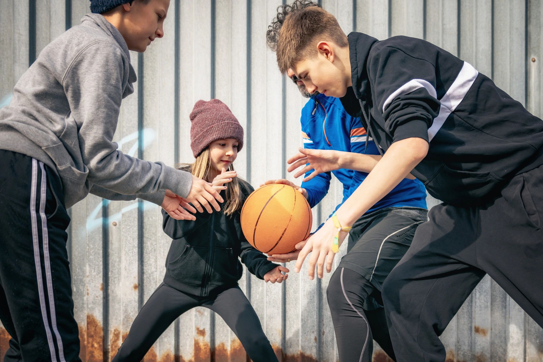 Students playing basketball together
